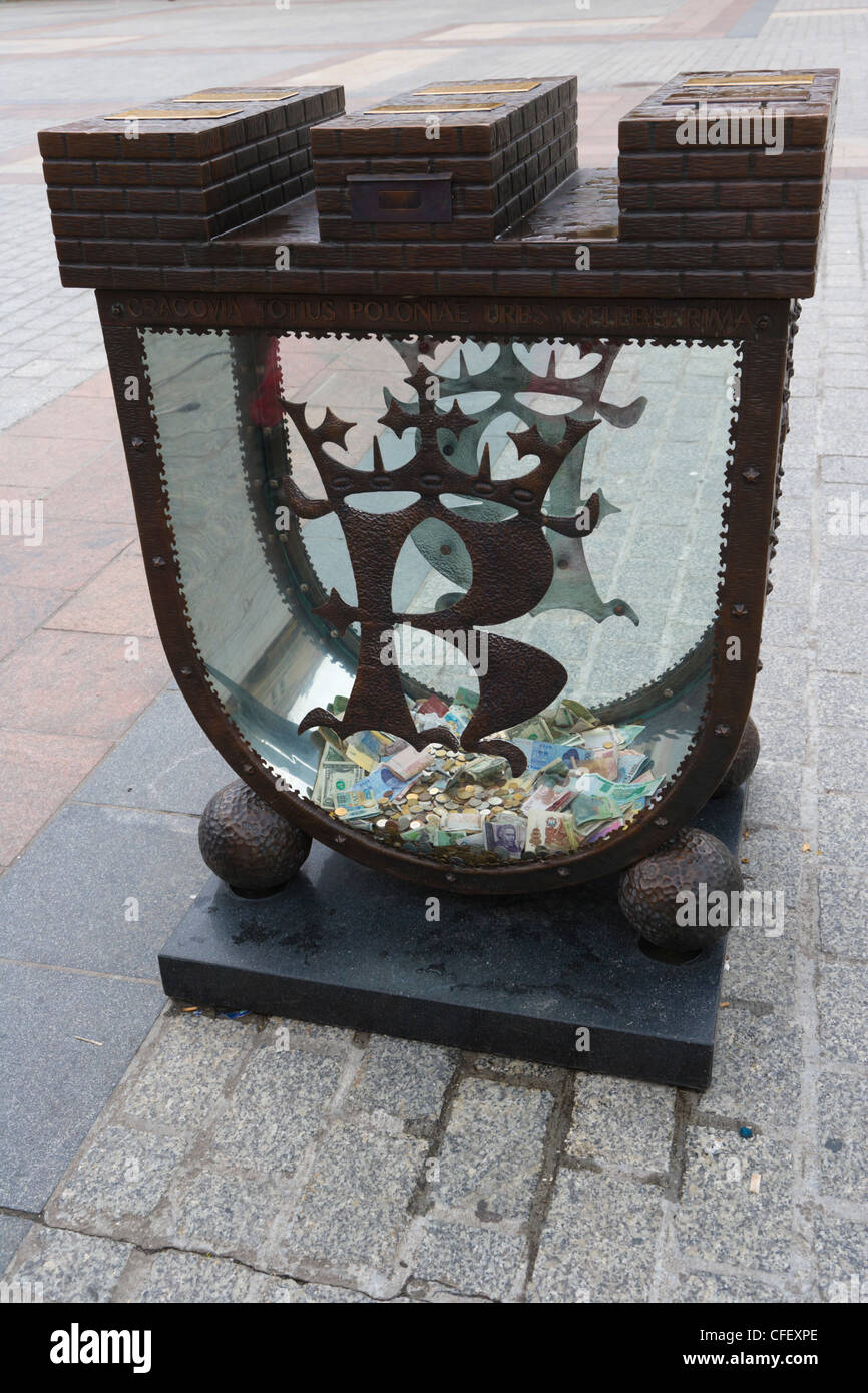 Piggy Bank, a money box in the shape of Cracow's coat of arms, Old Town, Krakow, Cracow, Poland Stock Photo