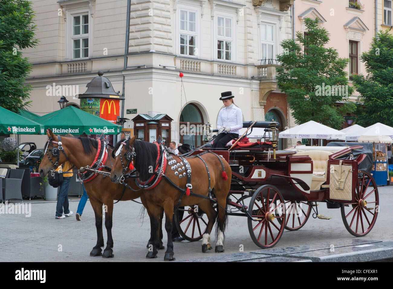 Horse drawn carriages, Main Market Square, Old Town, Krakow, Cracow, Malopolska Province, Lesser Poland Voivodeship, Poland Stock Photo