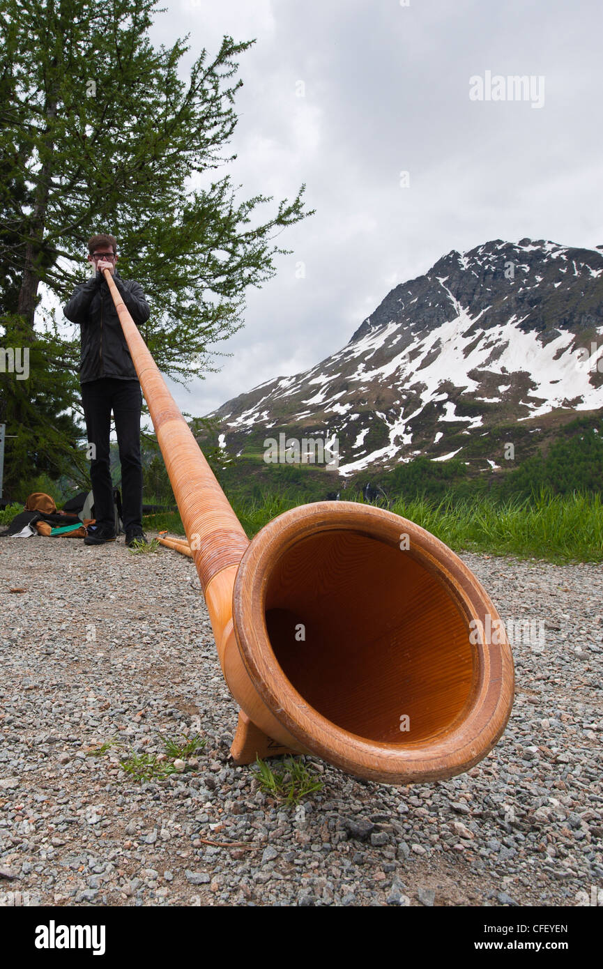 Man playing alpenhorn,alpine horn, Switzerland, Europe Stock Photo