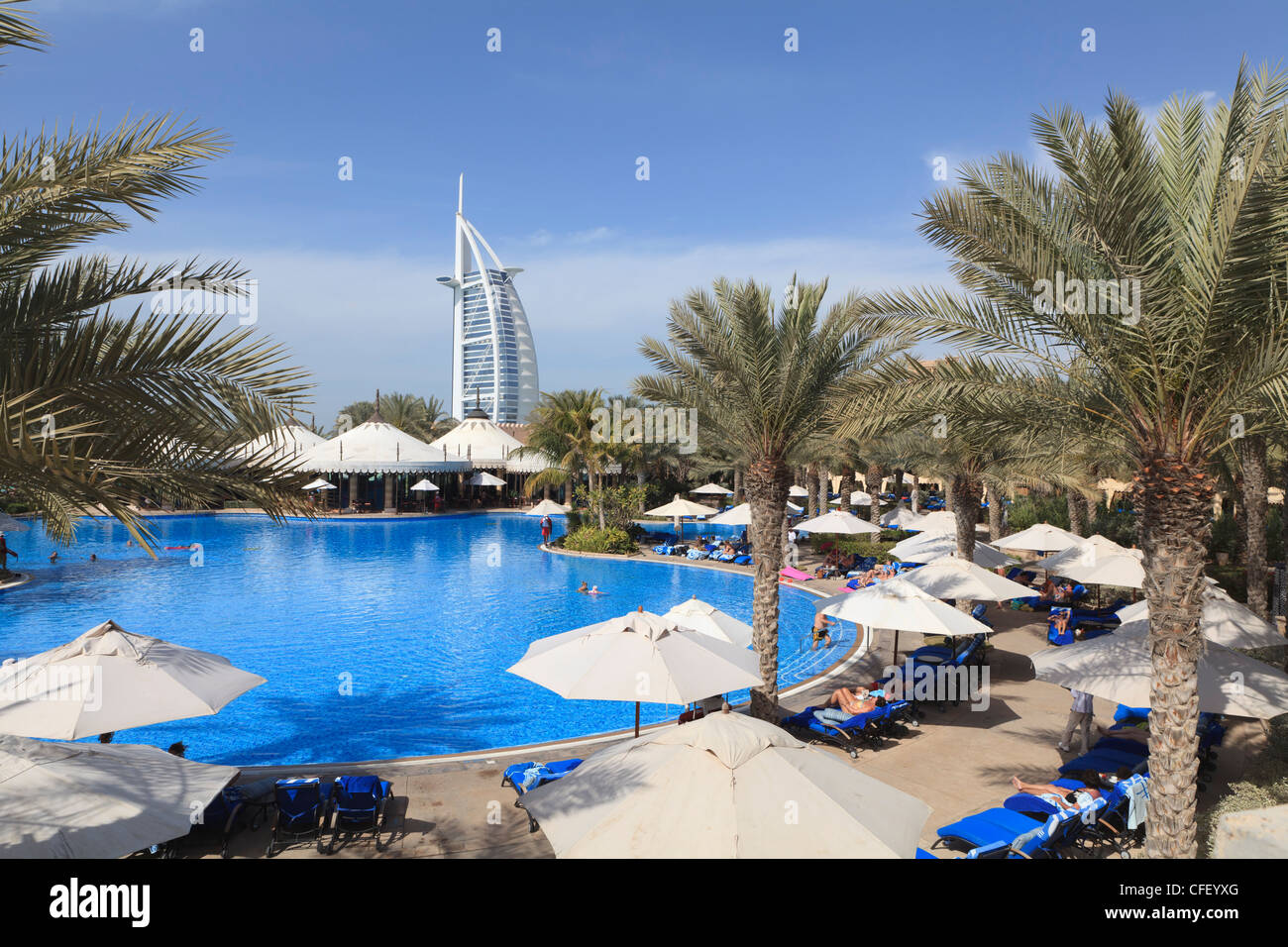 Burj Al Arab seen from the swimming pool of the Madinat Jumeirah Hotel, Jumeirah Beach, Dubai, United Arab Emirates, Middle East Stock Photo
