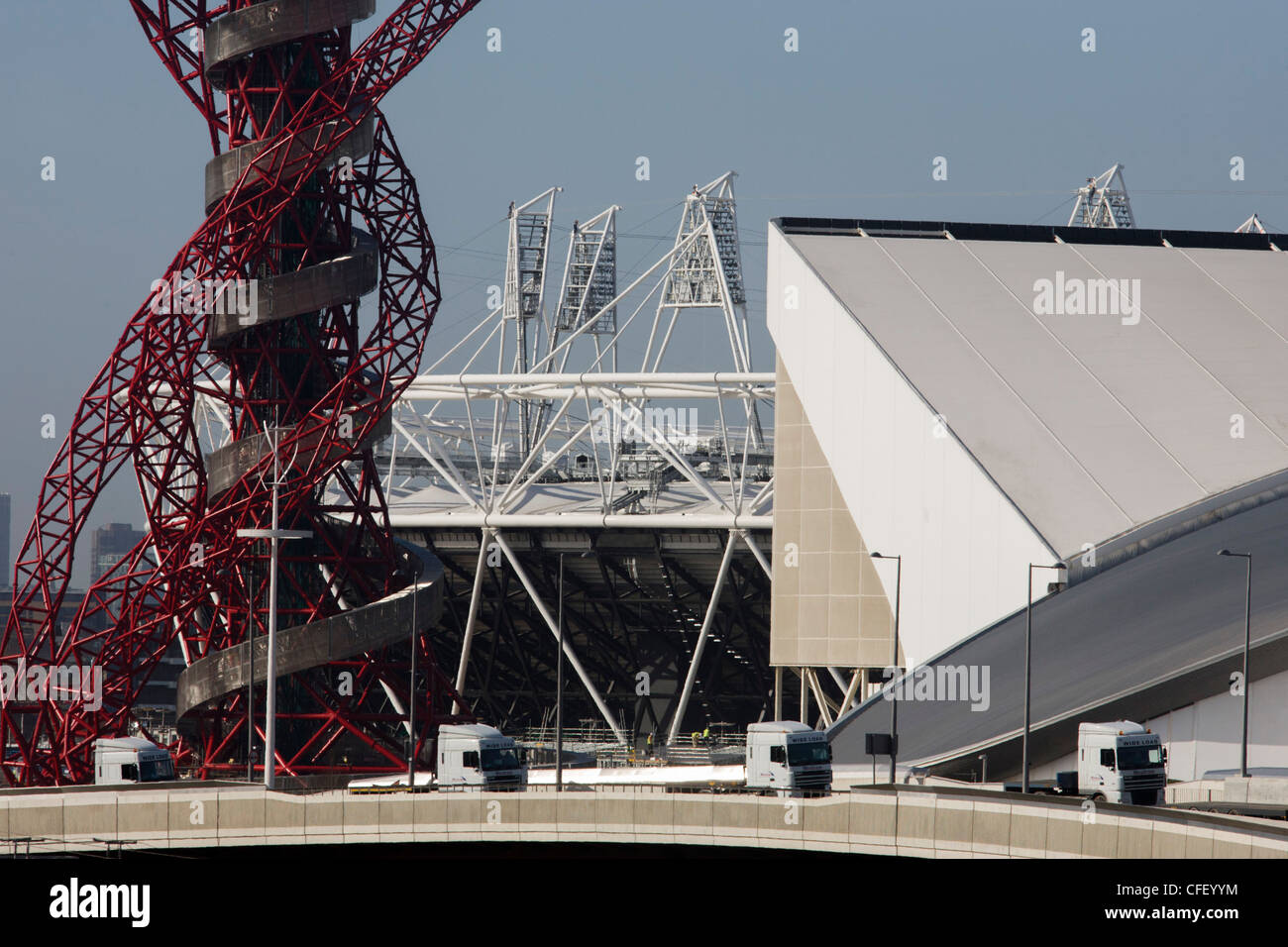 Landscape of 2012 Olympic construction site showing Aquatics centre, The Orbit art tower and the main stadium at Stratford. Stock Photo
