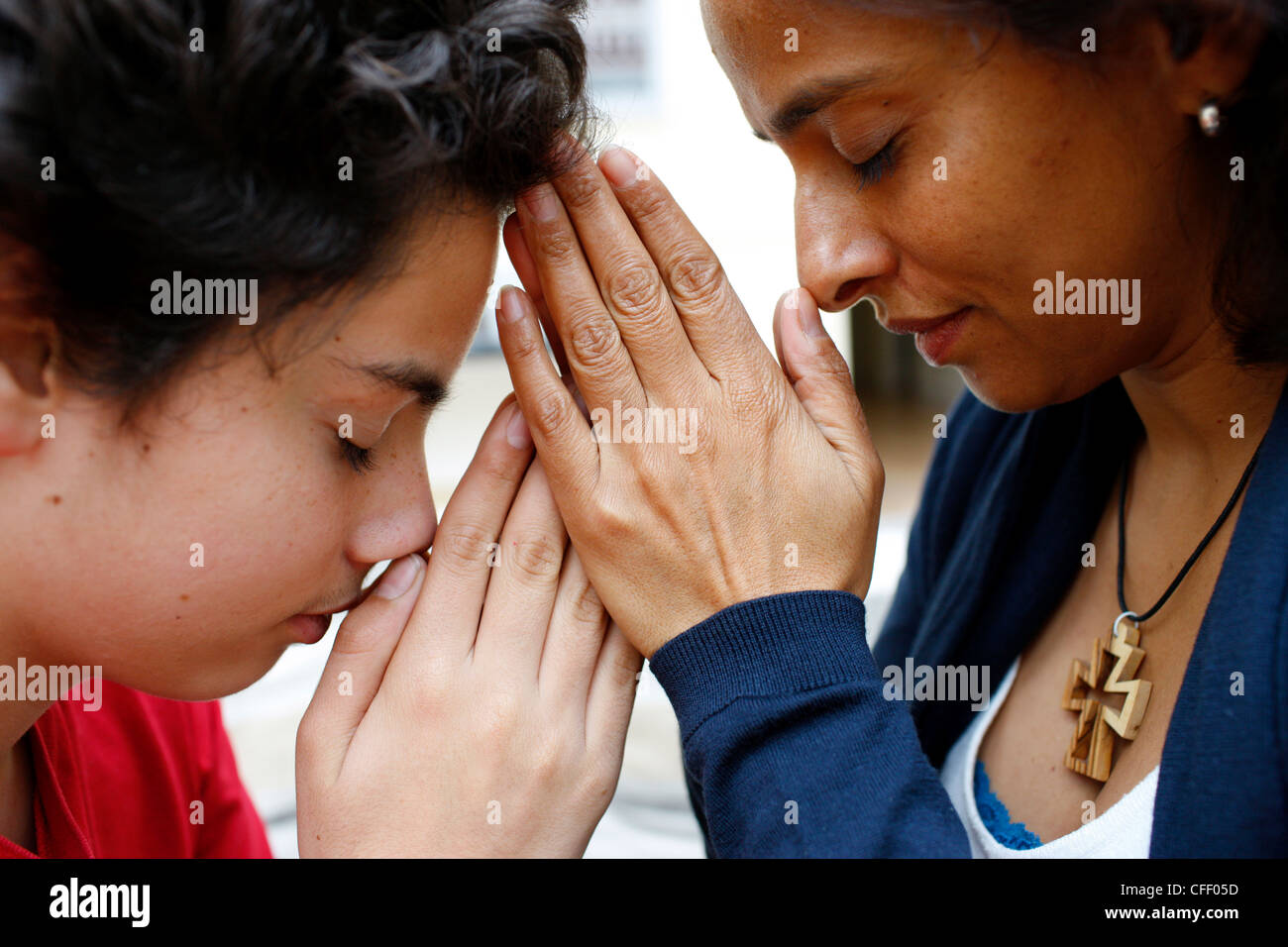 Mother and son praying at home, Paris, France, Europe Stock Photo