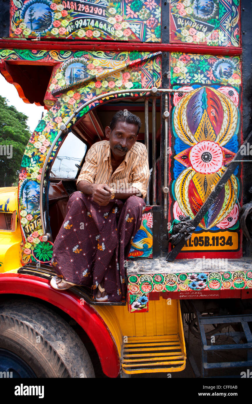 Kerelan driver sitting in cab of brightly decorated lorry, Kerala, India, Asia Stock Photo