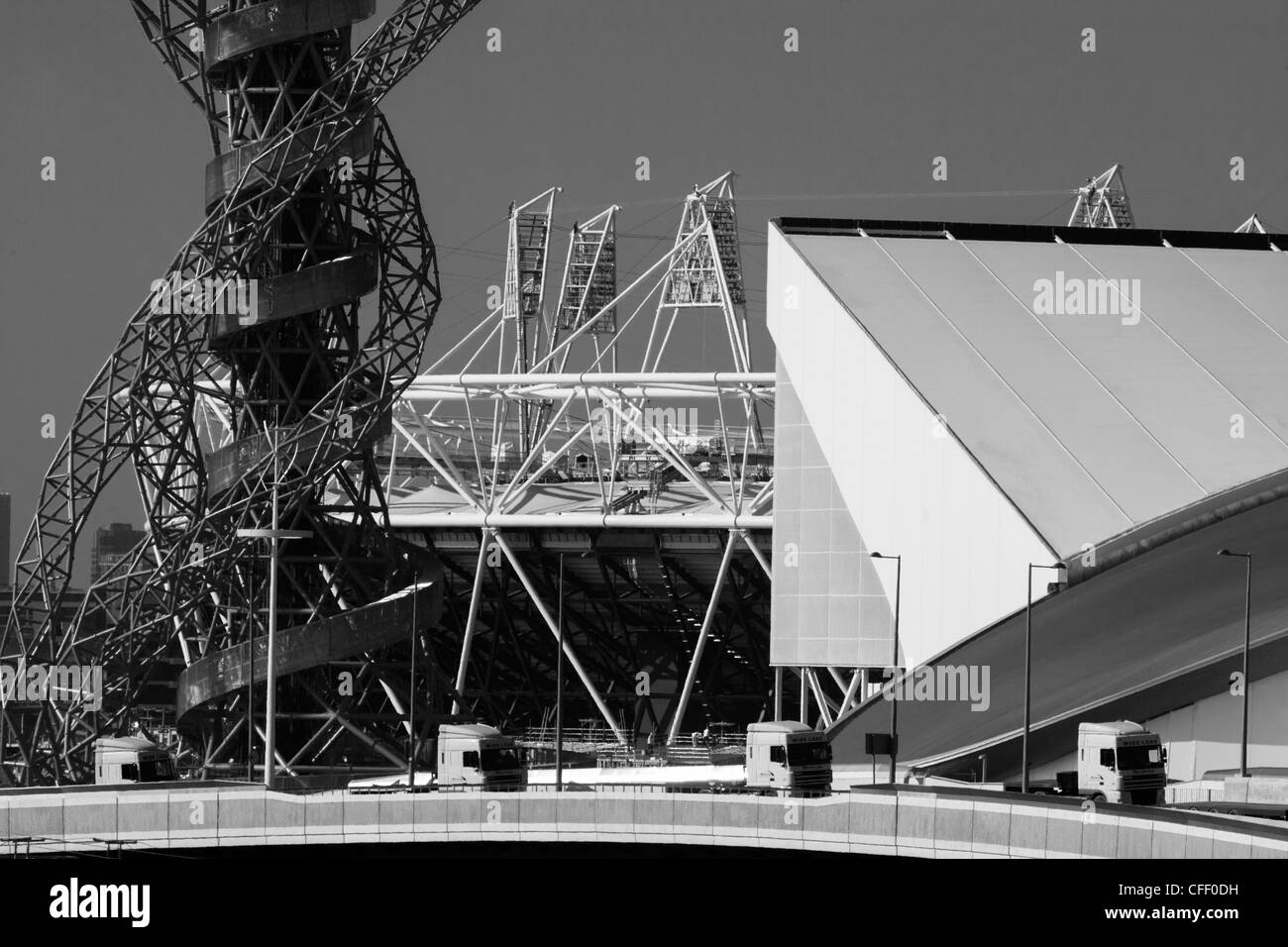 Landscape of 2012 Olympic construction site showing Aquatics centre, The Orbit art tower and the main stadium at Stratford. Stock Photo