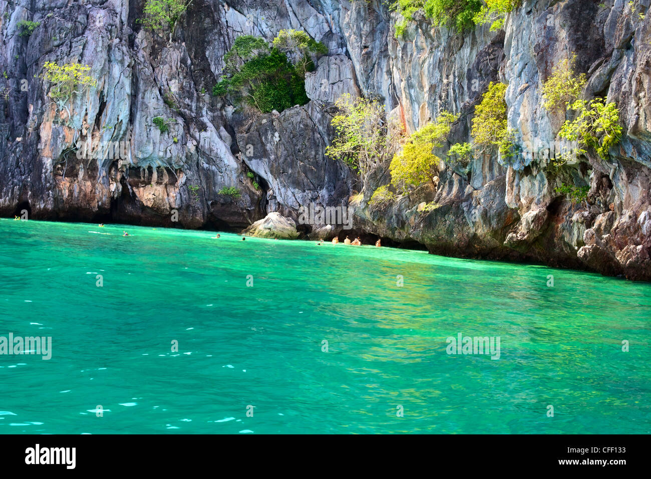 people snorkeling near Marakot Cave, Andaman Sea, Thailand Stock Photo