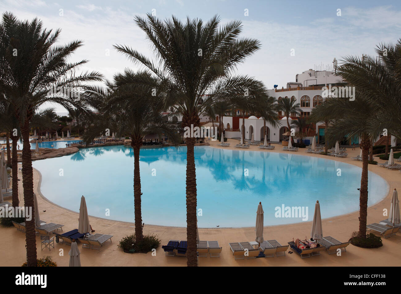 A palm fringed swimming pool within the Royal Savoy Resort at Sharm el-Sheikh, Egypt, North Africa, Africa Stock Photo