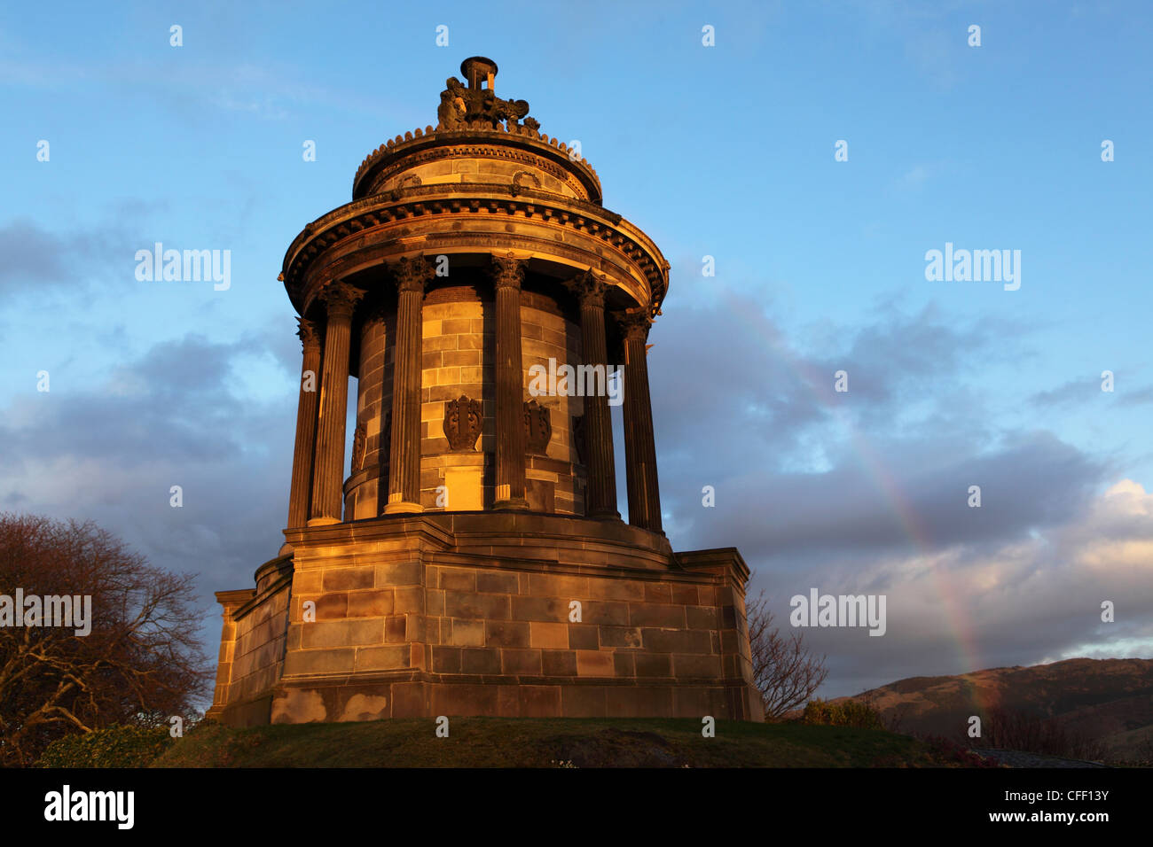 A rainbow curves over the Burns Memorial, dedicated to national poet Robbie Burns, Edinburgh, Scotland, United Kingdom, Europe Stock Photo