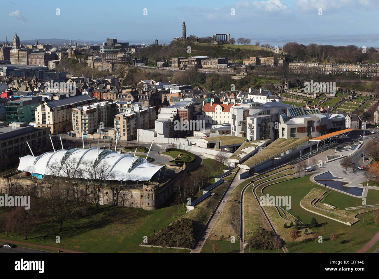 The Scottish Parliament stands in the foreground, under Calton Hill, in Edinburgh, Scotland, United Kingdom, Europe Stock Photo