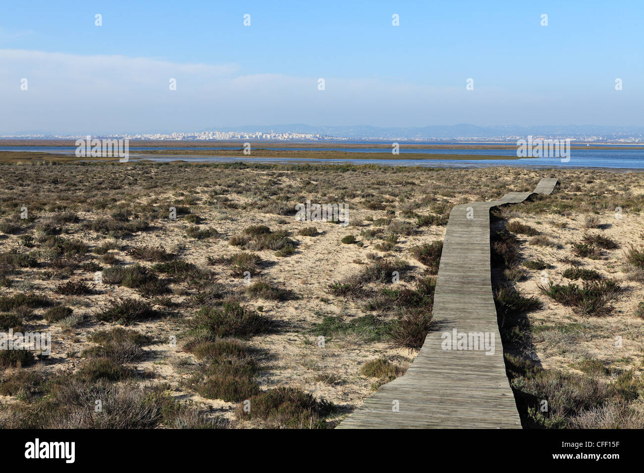 A boardwalk runs over dunes of Ilha Deserta (Barreta), an island in the Ria Formosa National Park, Algarve, Portugal, Europe Stock Photo