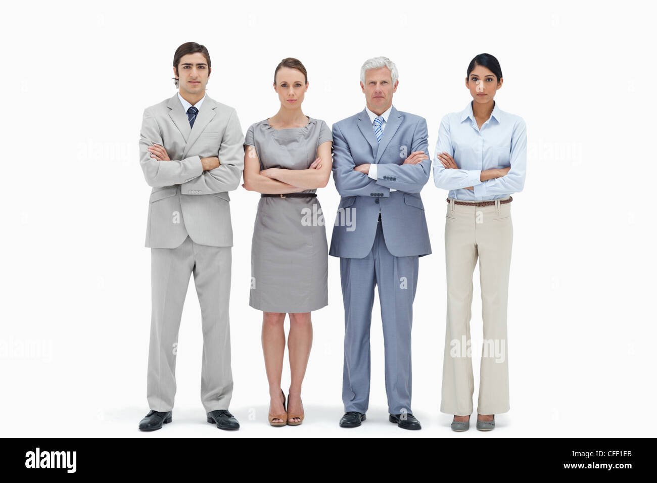 Serious multicultural business team crossing their arms Stock Photo