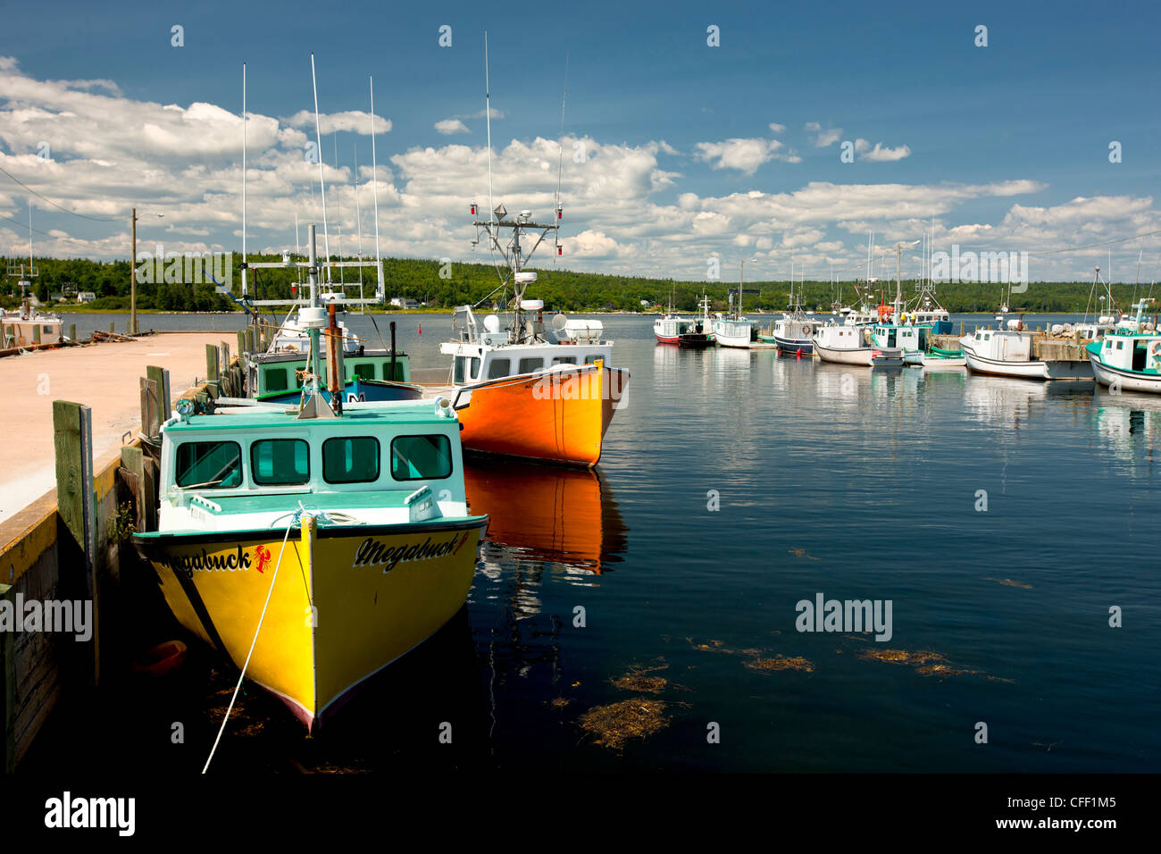 Fishing boats tied up at Central Port Mouton wharf, Nova Scotia, Canada Stock Photo