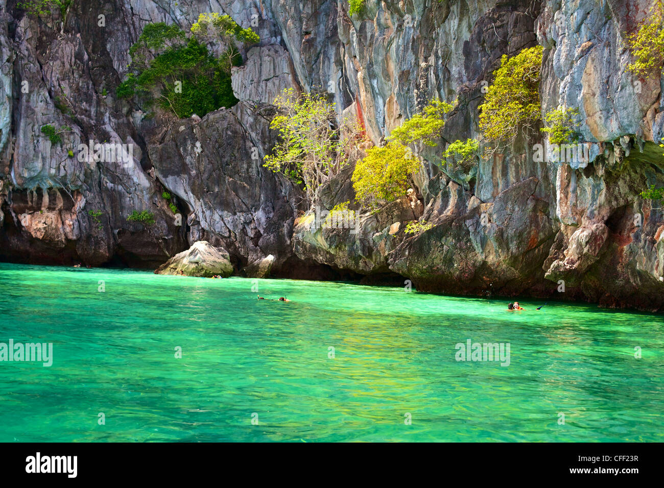 people snorkeling near Marakot Cave, Andaman Sea, Thailand Stock Photo