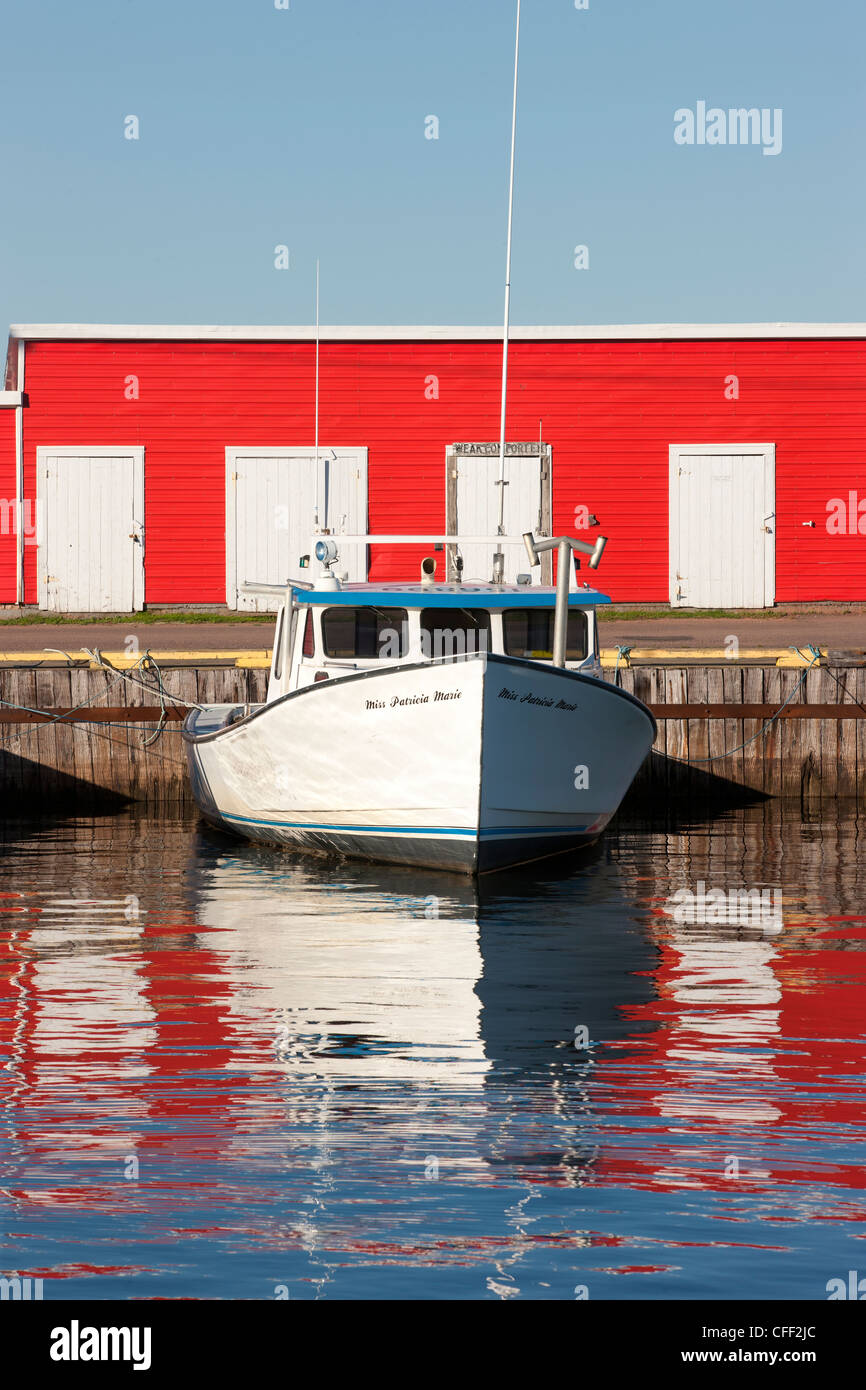 Fishing boat tied up at wharf, Northport, Prince Edward Island, Canada Stock Photo