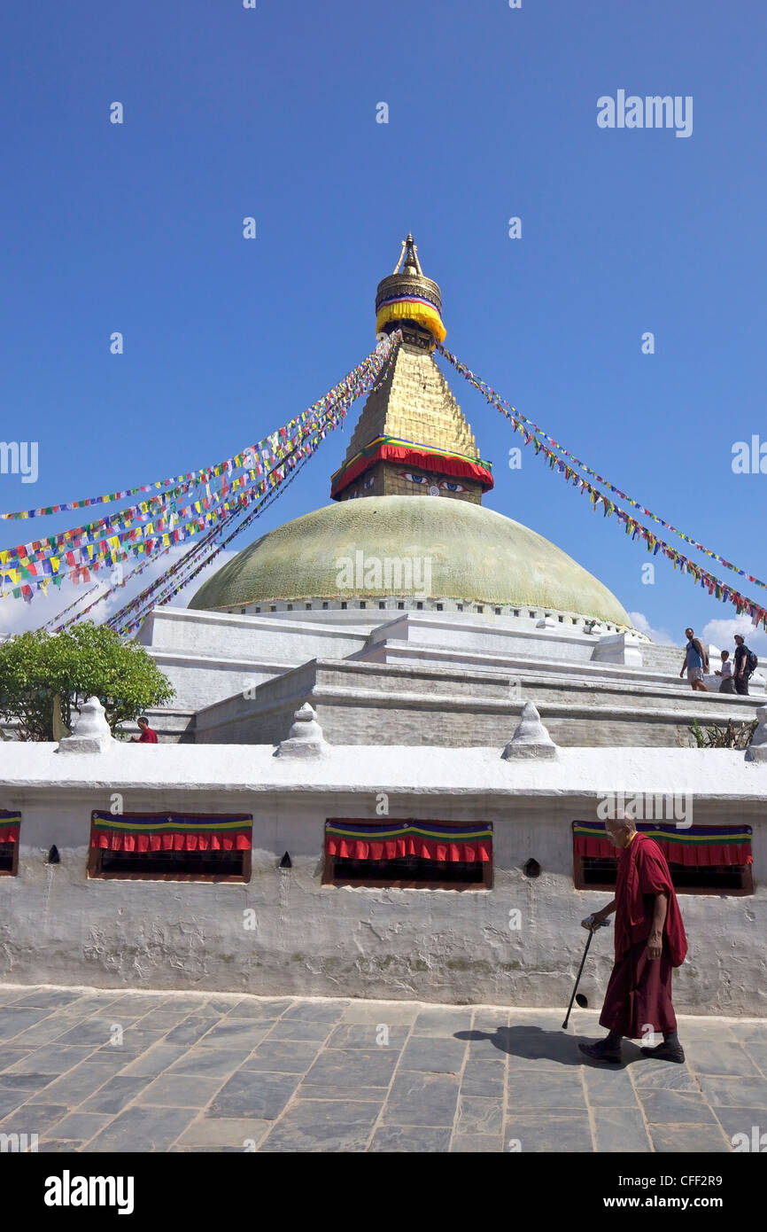 Monk at Boudhanath Stupa, ancient holy Buddhist site, UNESCO World Heritage Site, Kathmandu, Nepal, Asia Stock Photo