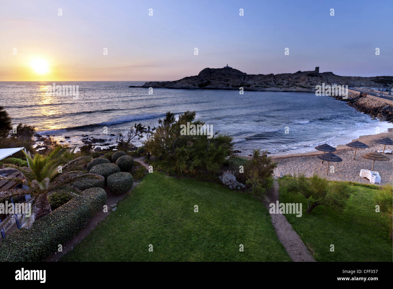 The beach and the peninsula of Ile Rousse at sunset, Corsica, France Stock Photo