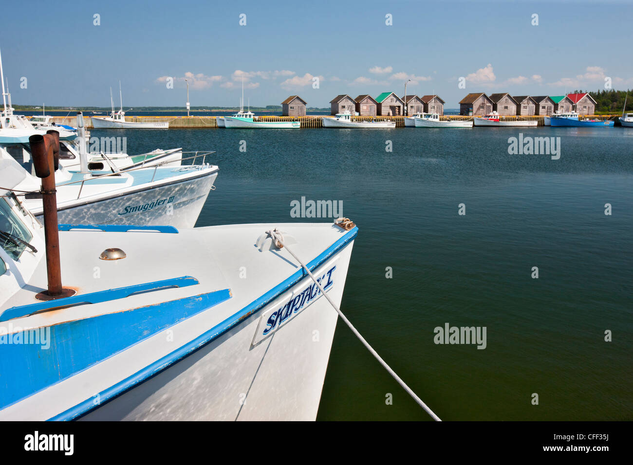 Fishing boats tied up at wharf, Fortune Bay Harbour, Prince Edward Island, Canada Stock Photo