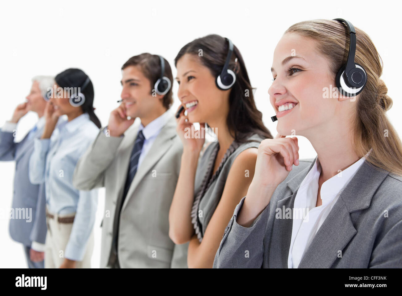 Smiling professionals with headsets Stock Photo