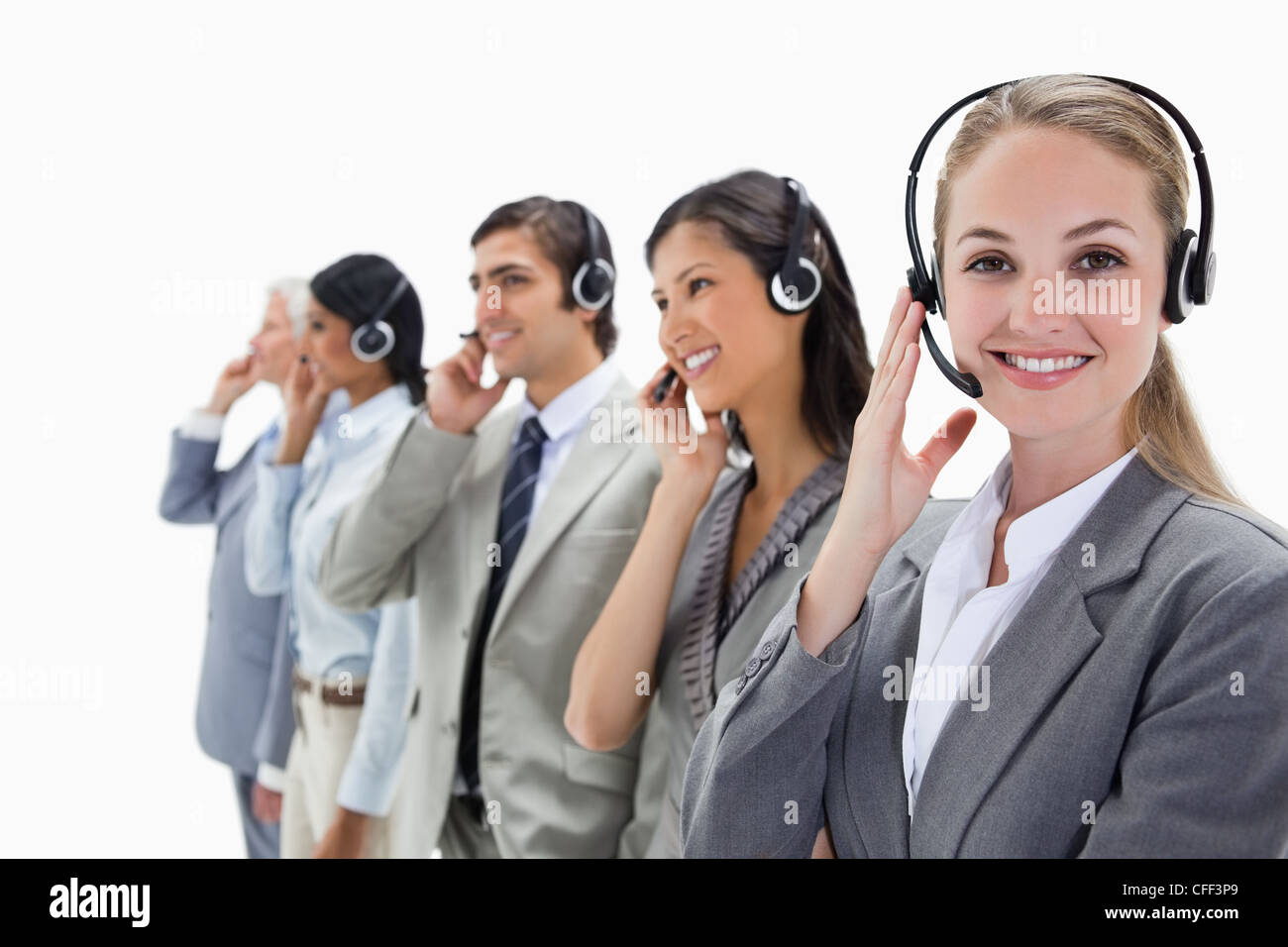 Smiling professionals listening with headsets Stock Photo
