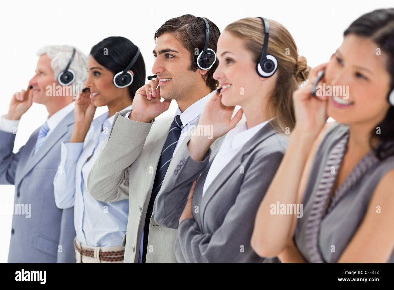 Smiling professionals listening Stock Photo