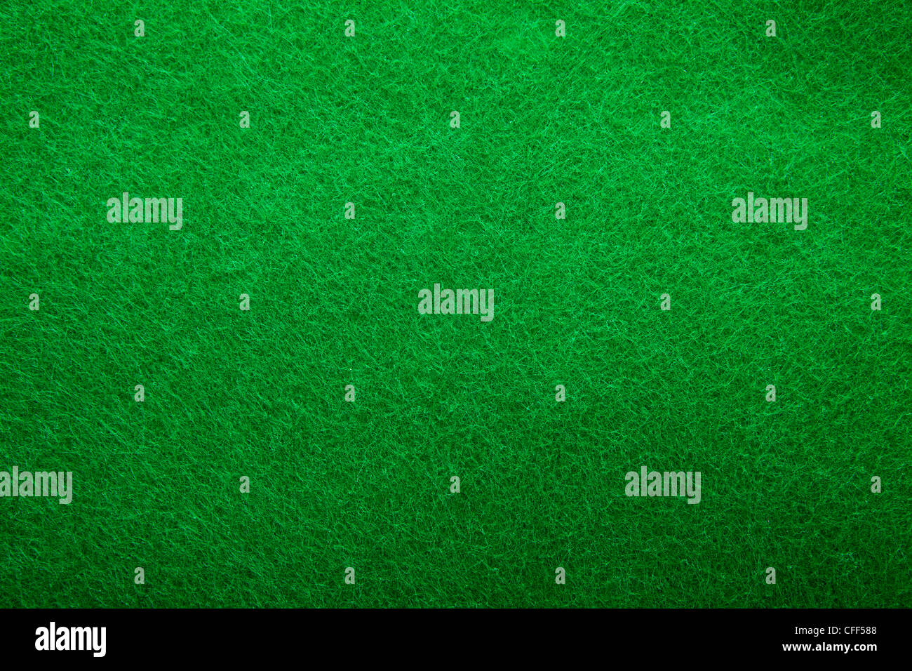 Background texture of green felt casino table in closeup Stock Photo