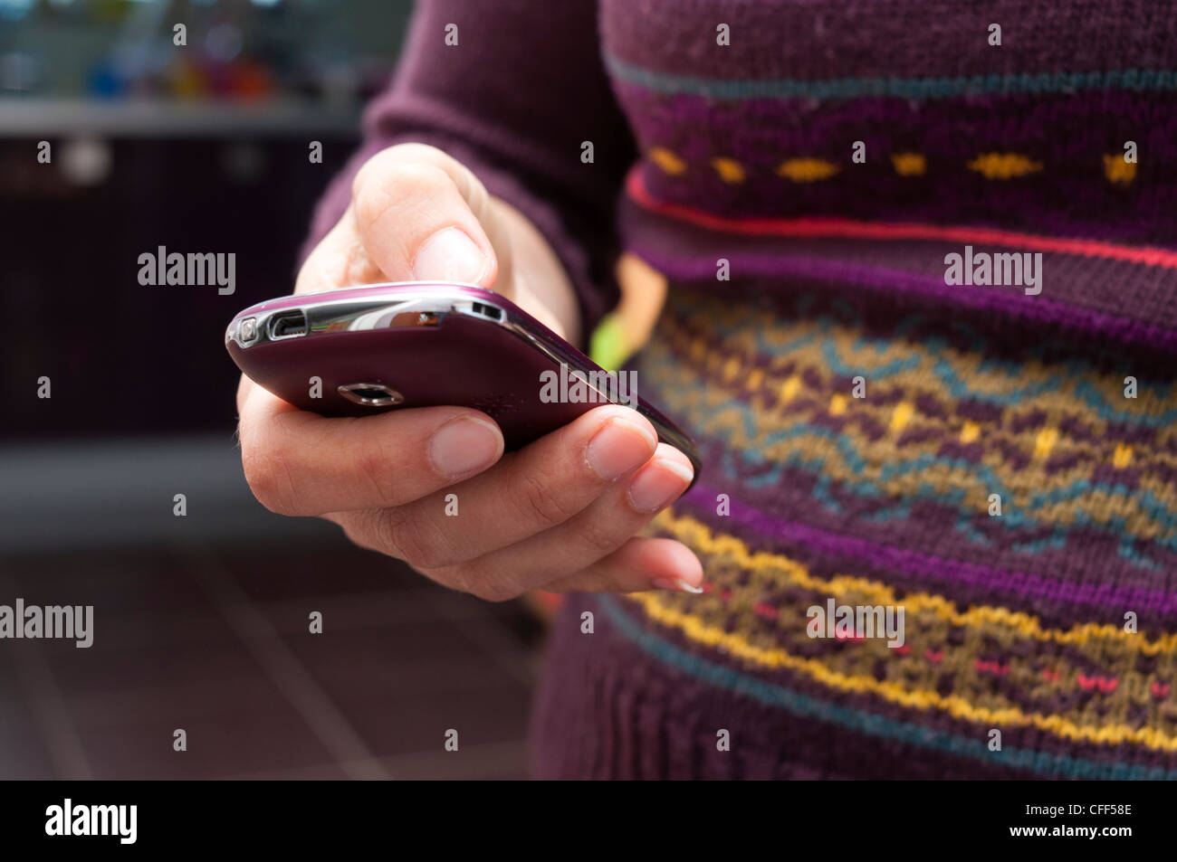 Close up of woman texting on a smartphone. Stock Photo