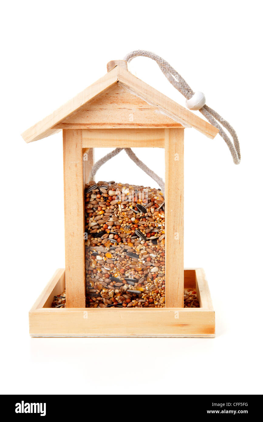 Wooden Bird Feeder House With Food Over White Background Stock