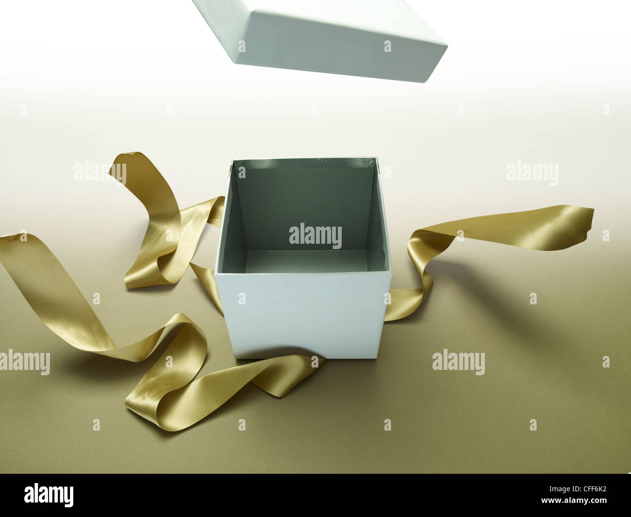 Gift box exploding open Stock Photo - Alamy