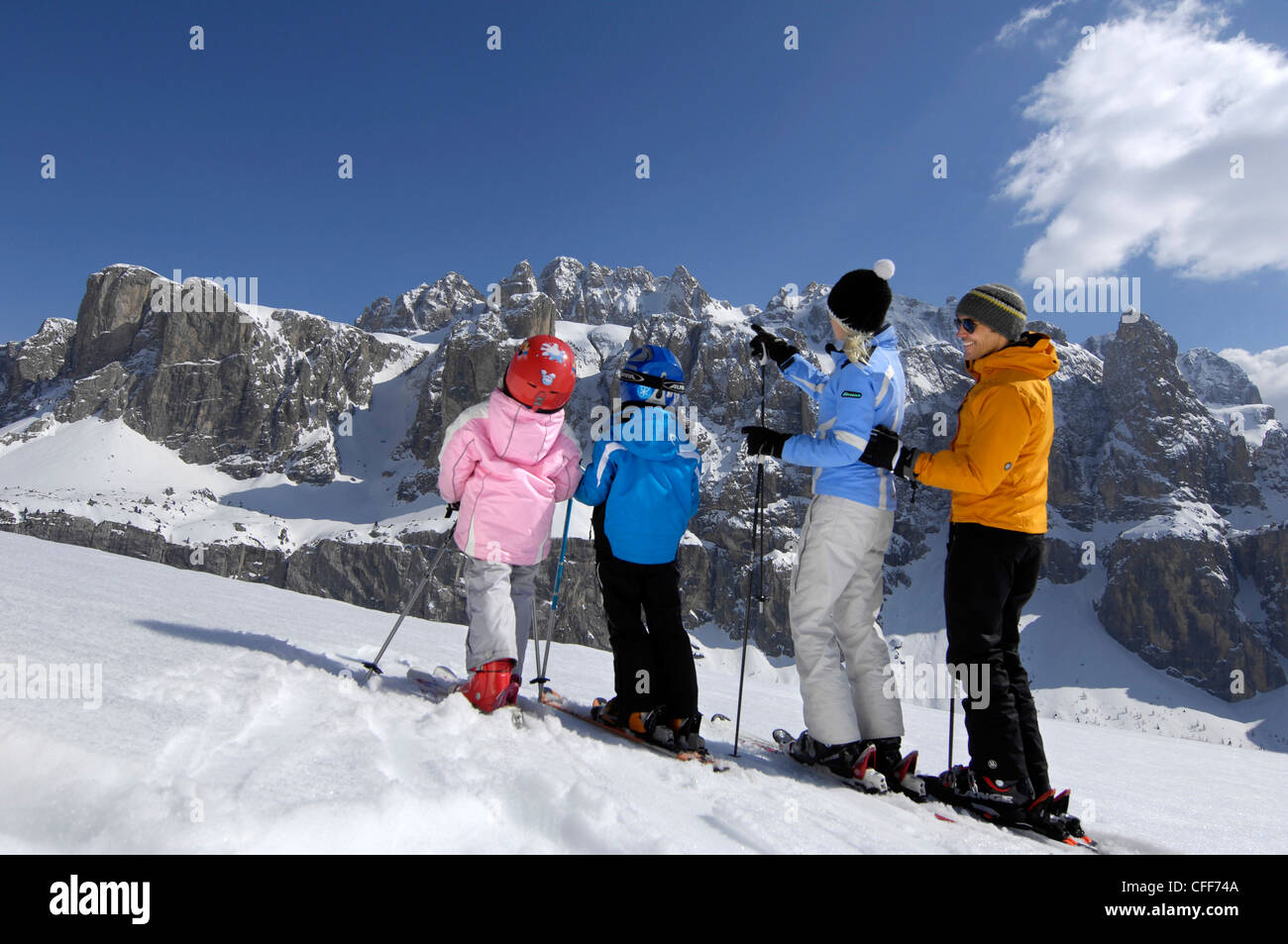 Family on skis in snowy mountain scenery, Alto Adige, South Tyrol, Italy, Europe Stock Photo