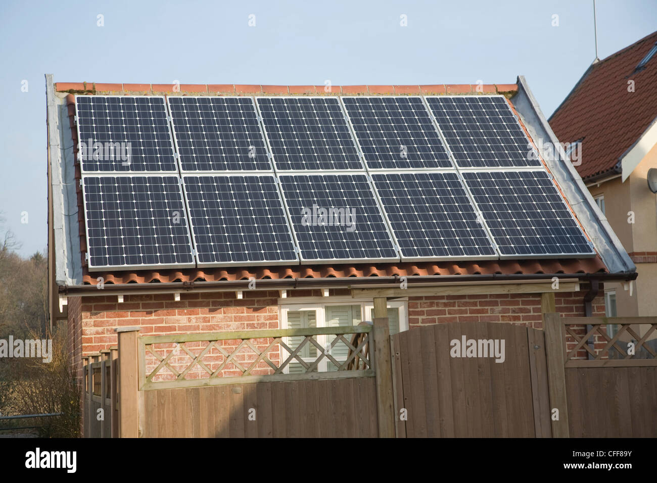 Domestic solar panel array on garage roof Stock Photo Alamy