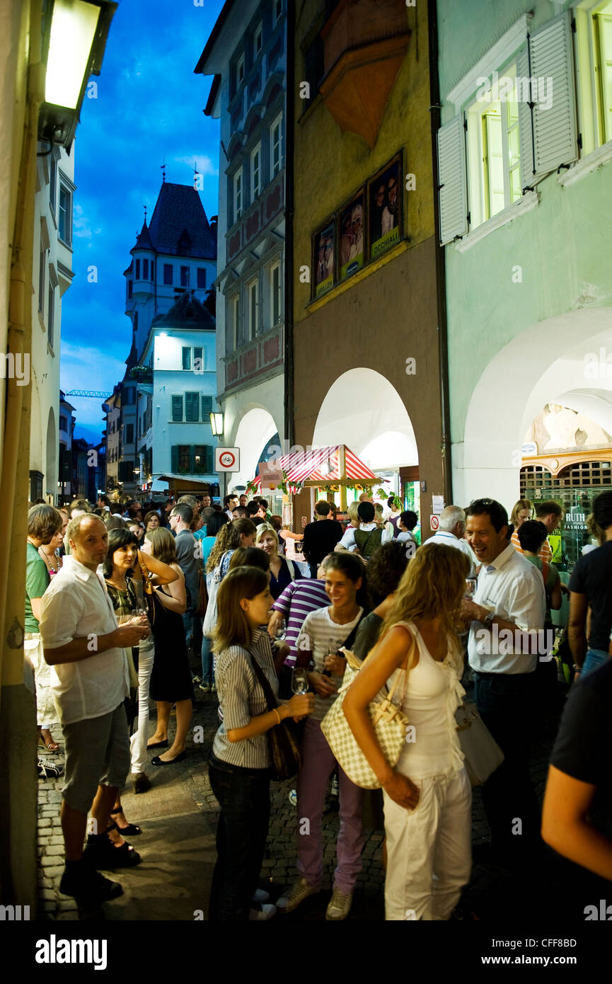 People on the street at the old town in the evening, Bolzano, South Tyrol, Alto Adige, Italy, Europe Stock Photo