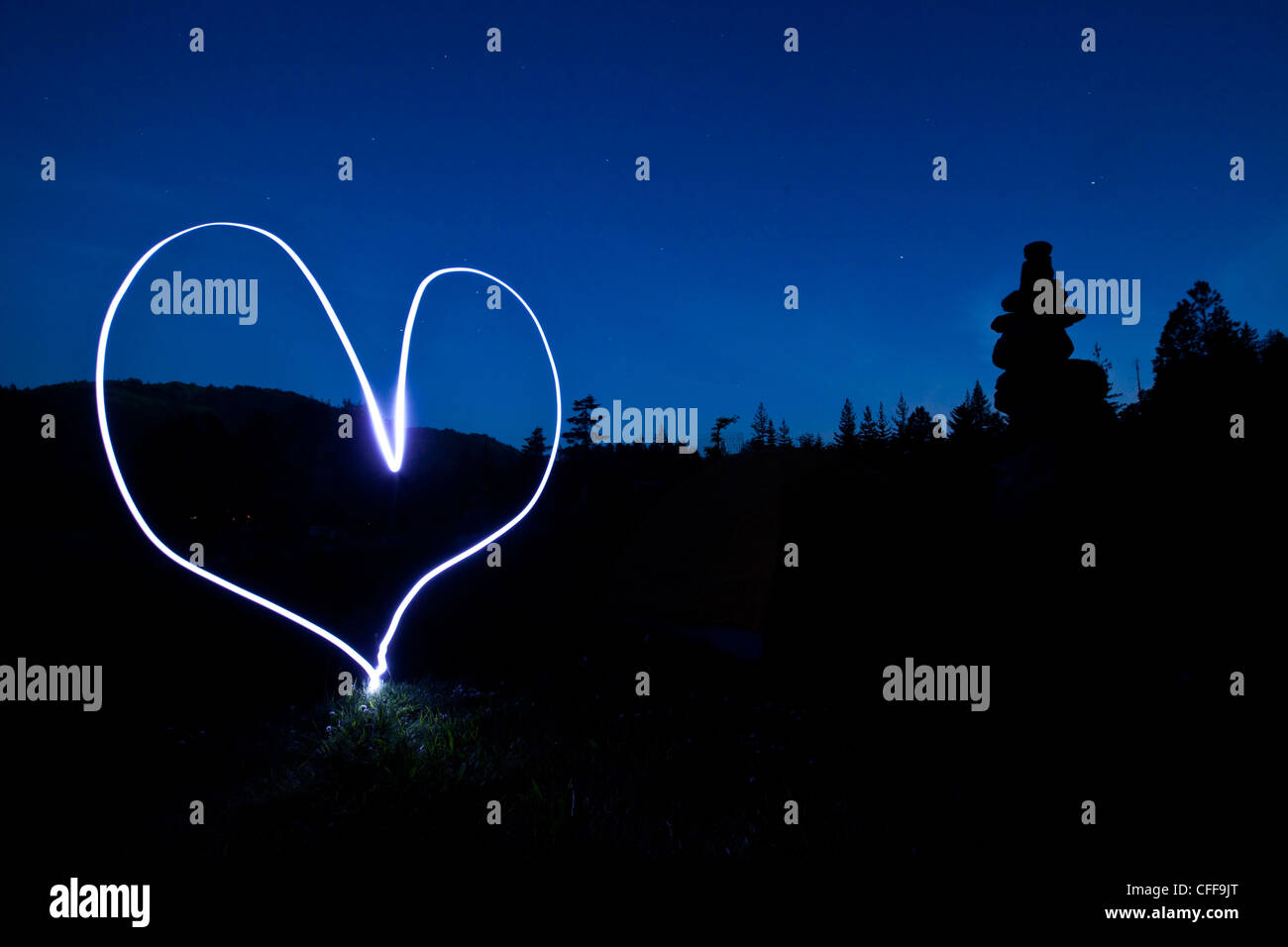 A light painting of a heart at sunset in Idaho. Stock Photo