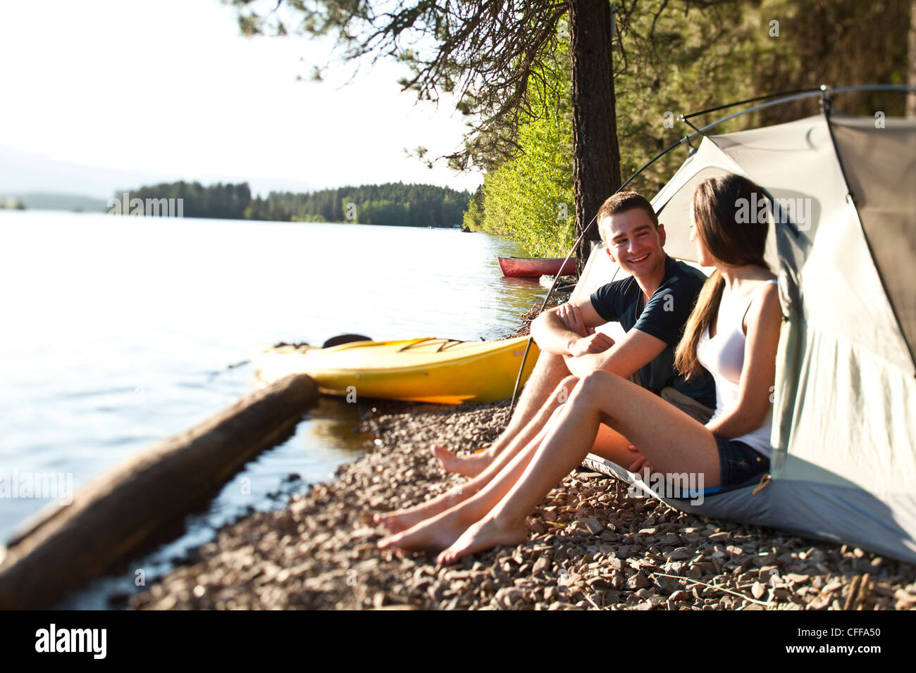 Two Young Adults Laugh And Smile On A Camping And Kayaking Trip In Idaho Stock Photo Alamy