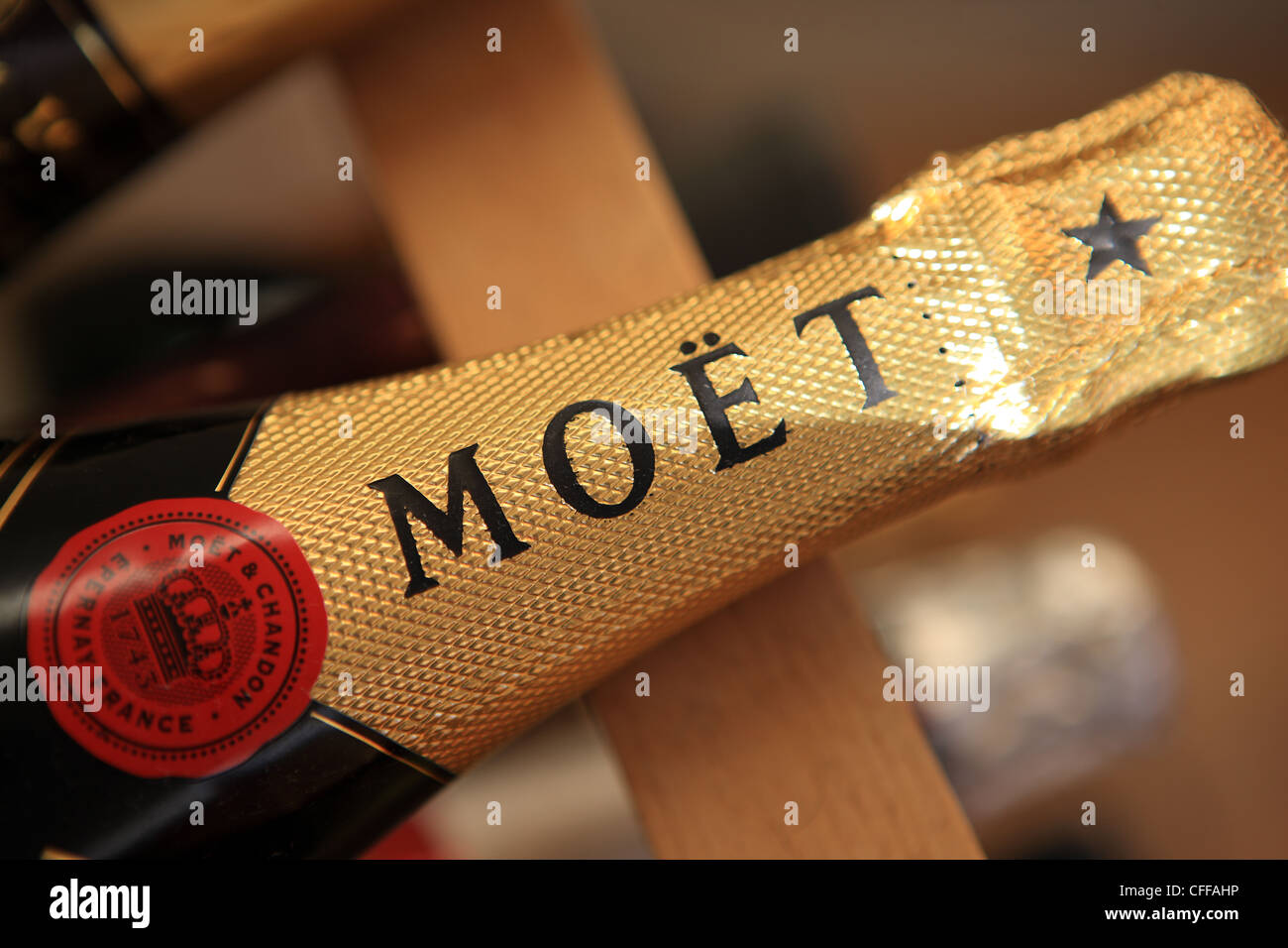 A bottle of Moet Champagne in a wine rack Stock Photo