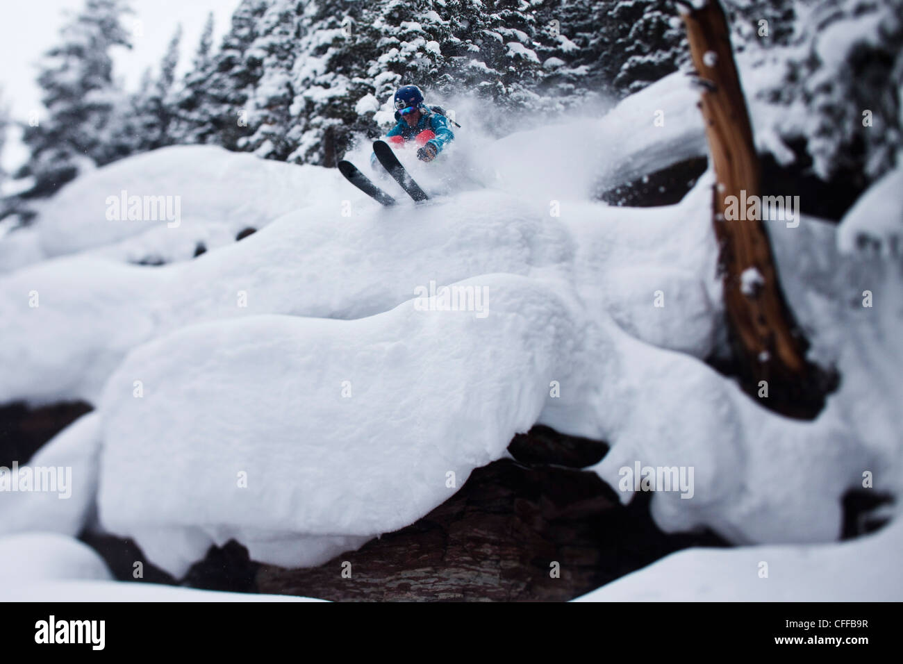 A male skier blasts through powder pillows in the backcountry in Colorado. Stock Photo