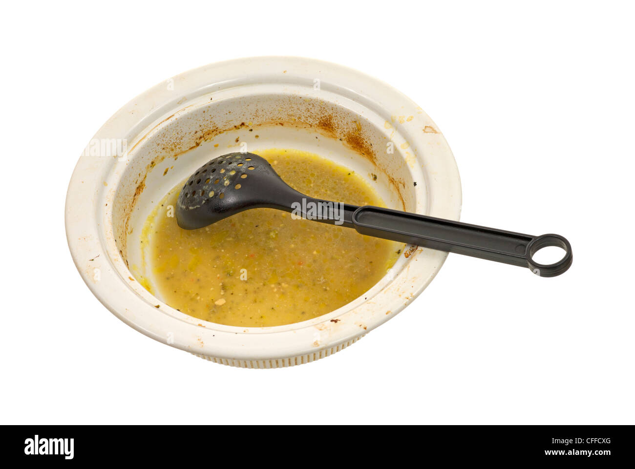 Dirty dish with spoon Stock Photo