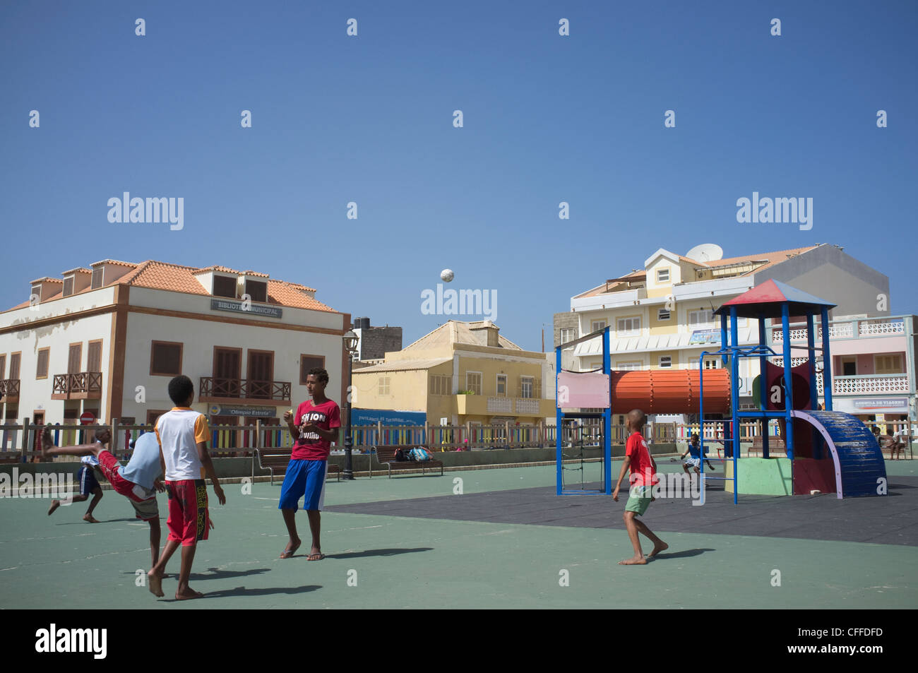 Sal Rei Boa Vista Cape Verde Group of young bare footed boys playing  football in play ground referee showing yellow card Stock Photo - Alamy