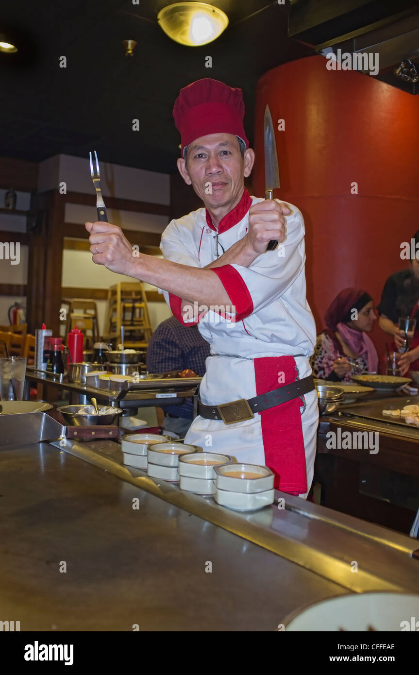 Japanese chef cooking at restaurant Stock Photo
