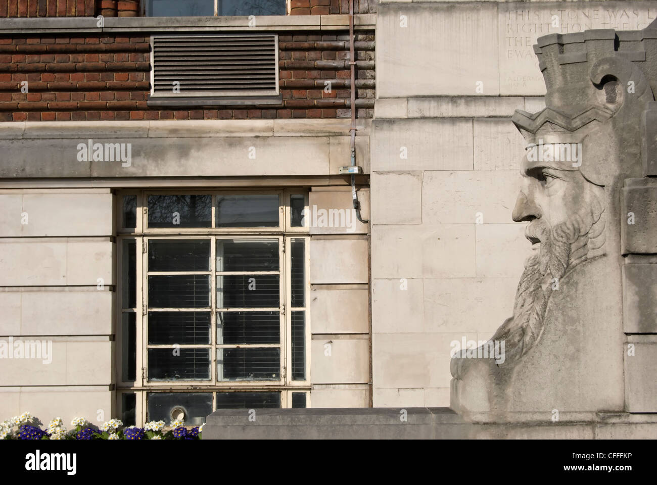 figure of old father thames marking the original entrance to the 1930s  hammersmith town hall, london, england Stock Photo