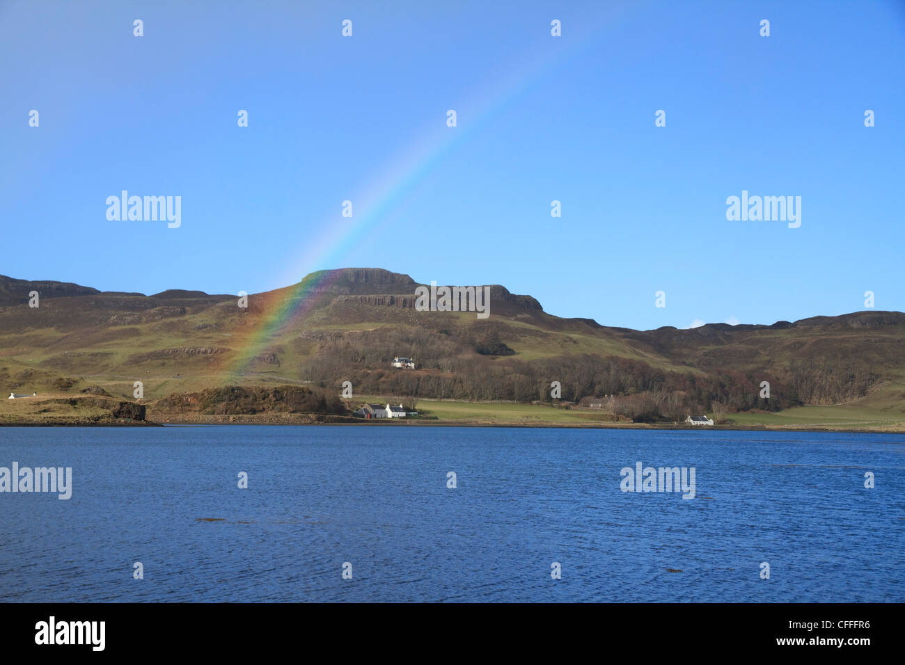A rainbow arcs over the bay between Sanday and Canna , the Small Isles, Scotland Stock Photo