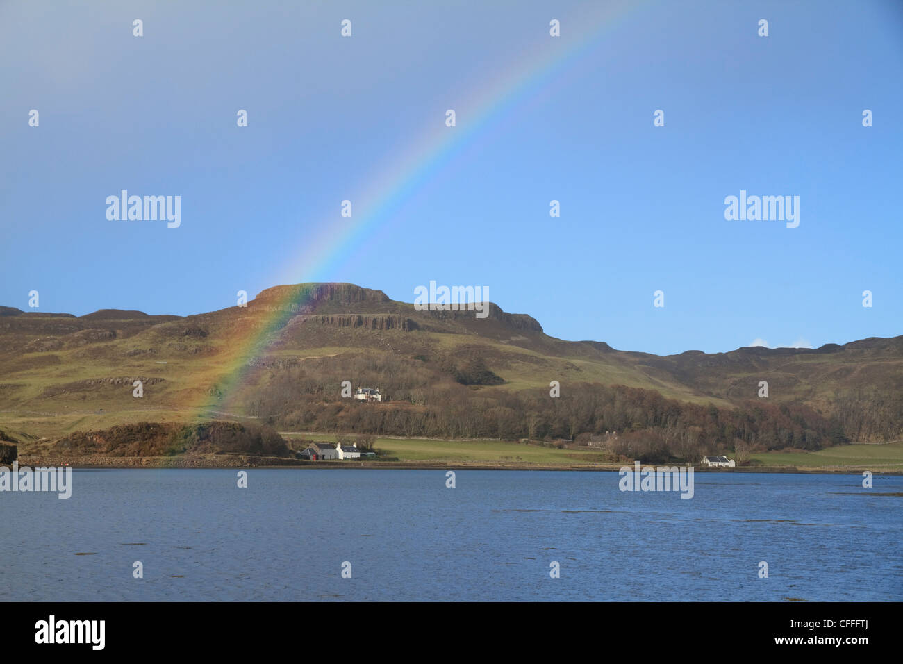 A rainbow arcs over the bay between Sanday and Canna , the Small Isles, Scotland Stock Photo