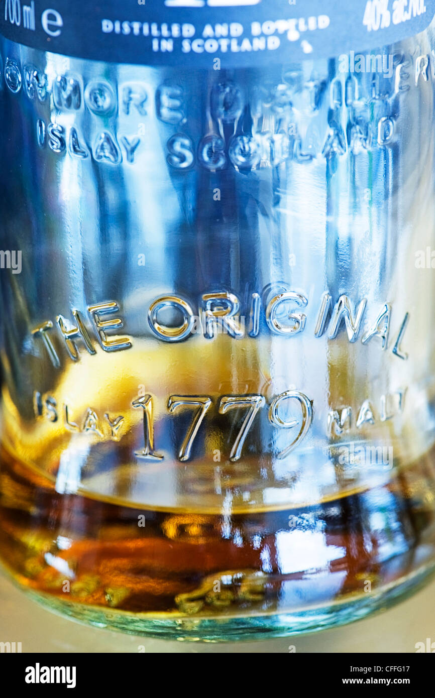 Macro micro close up photo photography abstract pattern detail glass bottle of Scottish whisky scotch Original Islay Malt 1779 Stock Photo
