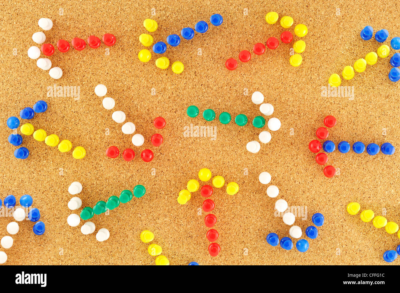 colorful arrows with random pined on cork board Stock Photo