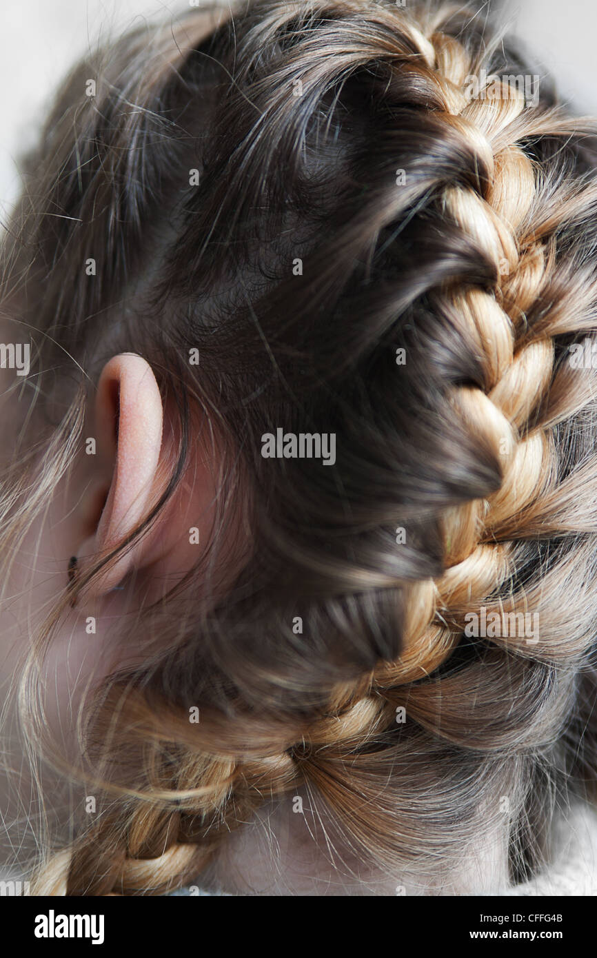 Braids 'dragon', braided on the head of the girl Stock Photo