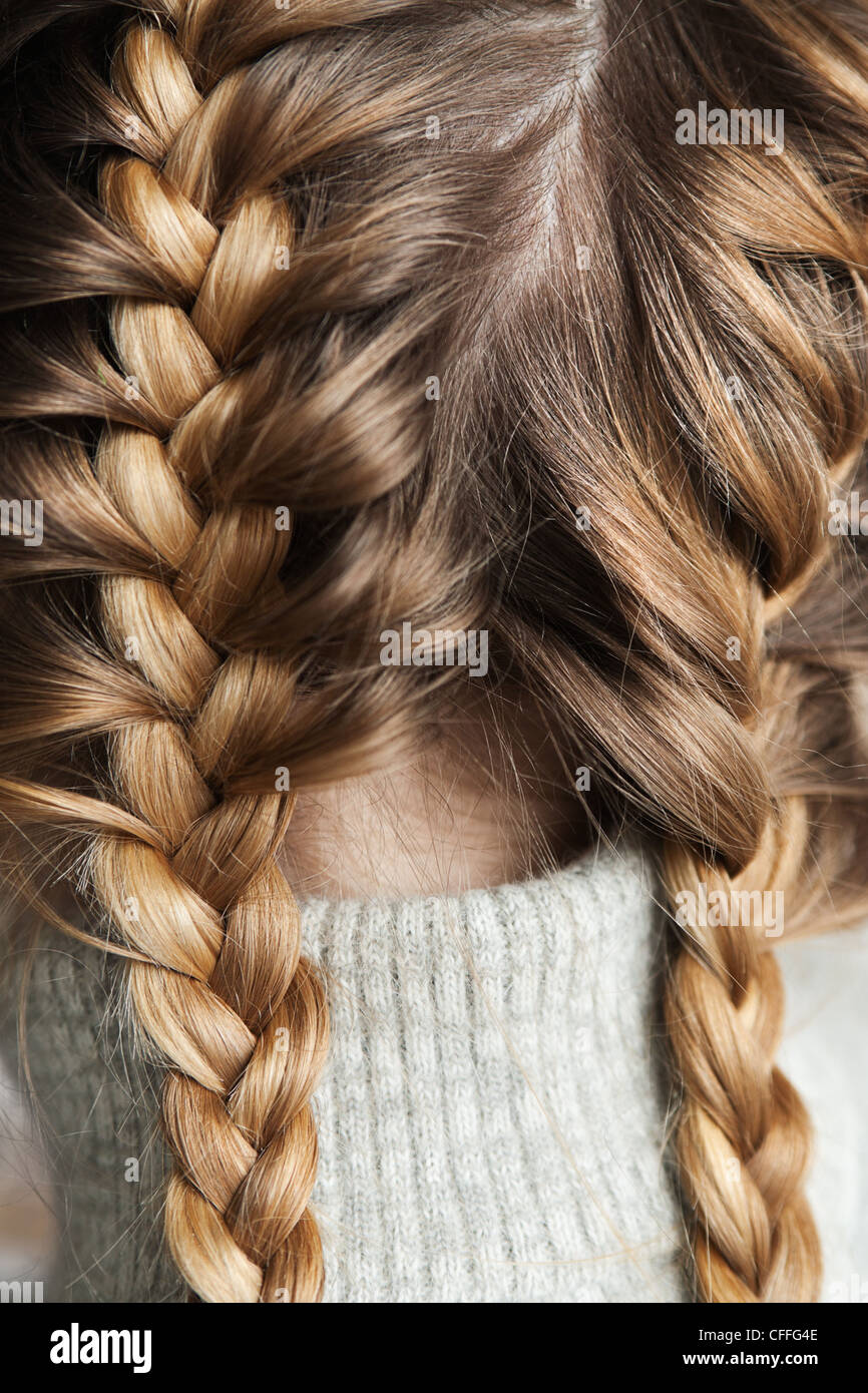 Two braids 'dragon', braided on the head of the girl Stock Photo