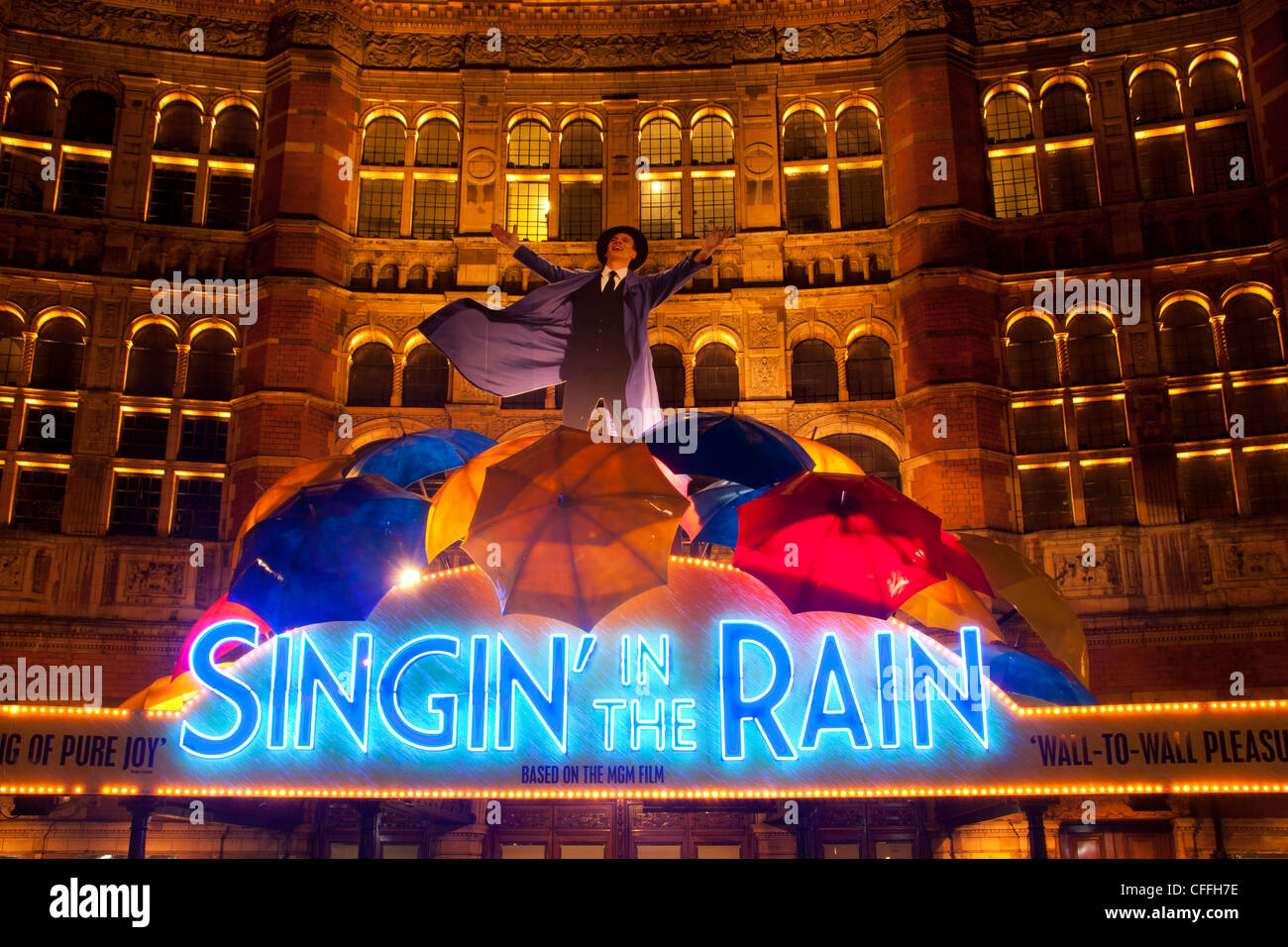 Singin' in the Rain Neon sign and umbrella display advertising musical Palace Theatre West End London England UK Stock Photo