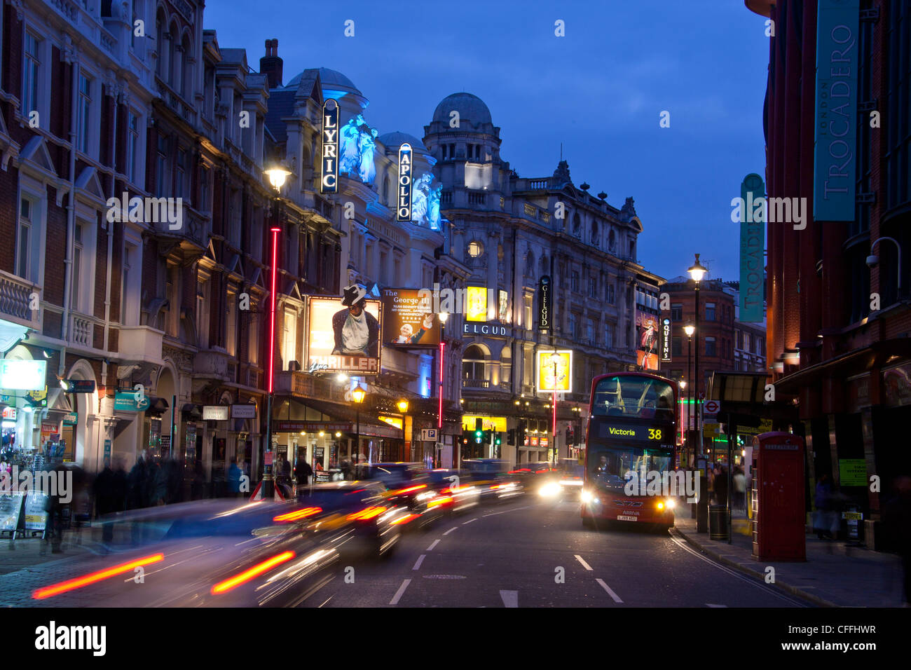 London Theatreland West End Shaftesbury Avenue busy at night with traffic trails London England UK Stock Photo