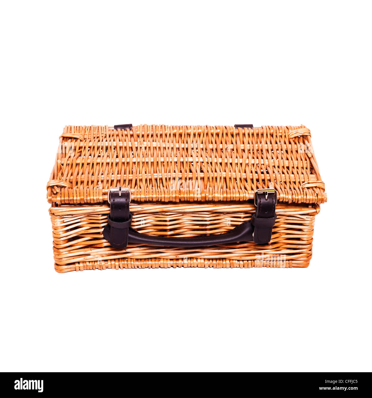 A small traditional wicker picnic basket on a white background Stock Photo