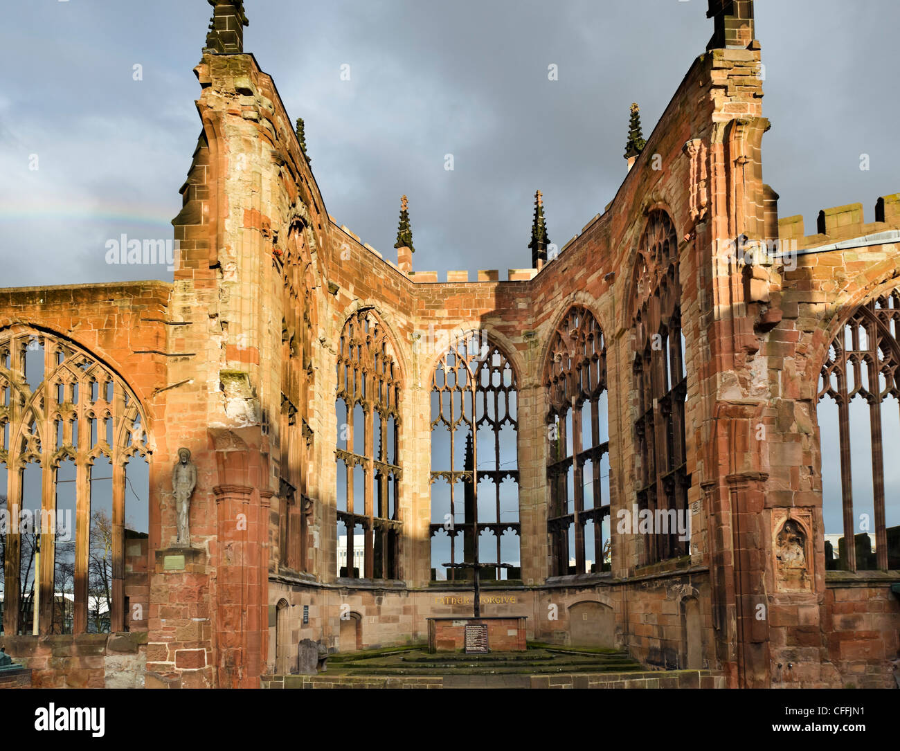 The altar of the old bombed out cathedral in late afternoon sunshine after a storm, Coventry, West Midlands, England, UK Stock Photo