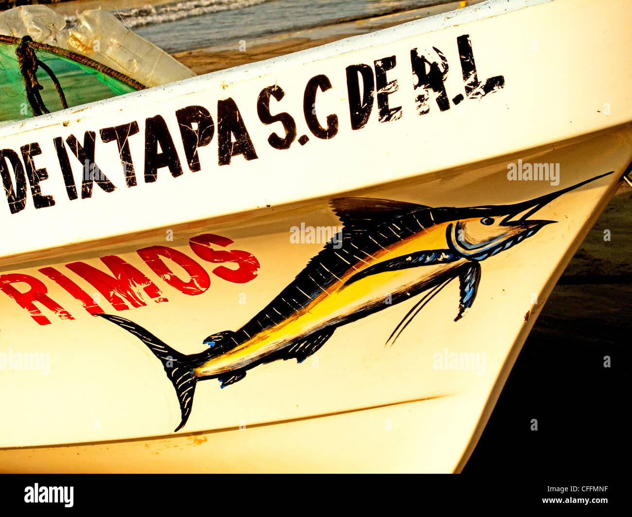 Detail of a fishing boat with a swordfish painted on it on Meliá Azul beach in Ixtapa, Mexico Stock Photo
