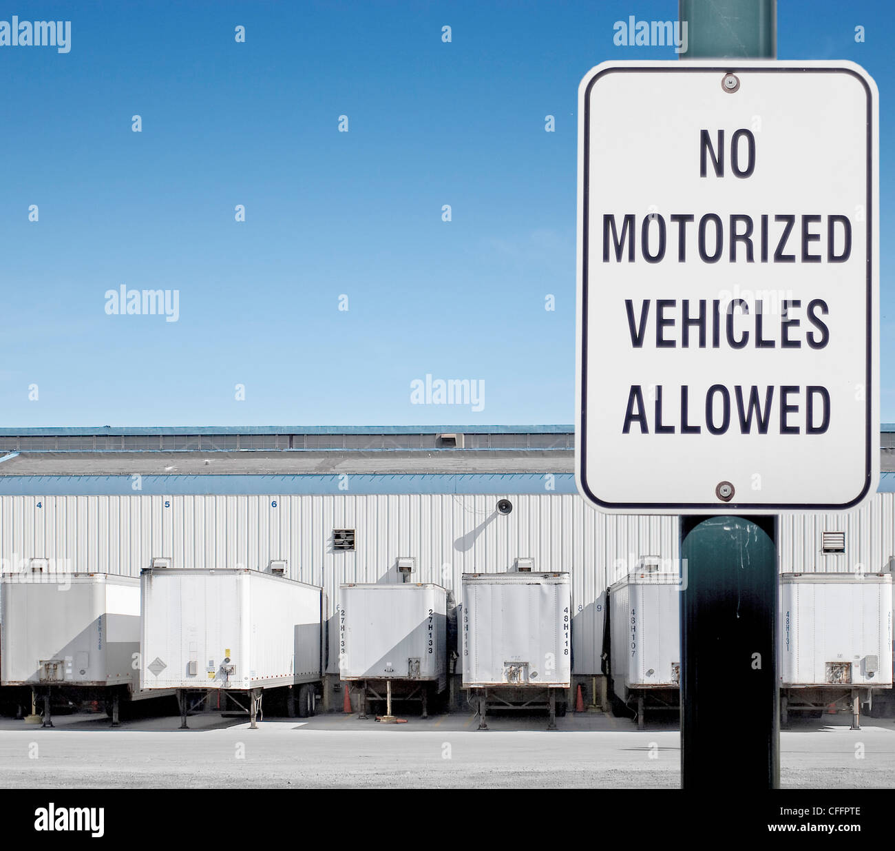 No Motorized Vehicles Allowed Sign In Front Of Truck Loading Bays Stock Photo Alamy